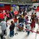 Passengers fall in line at the counter