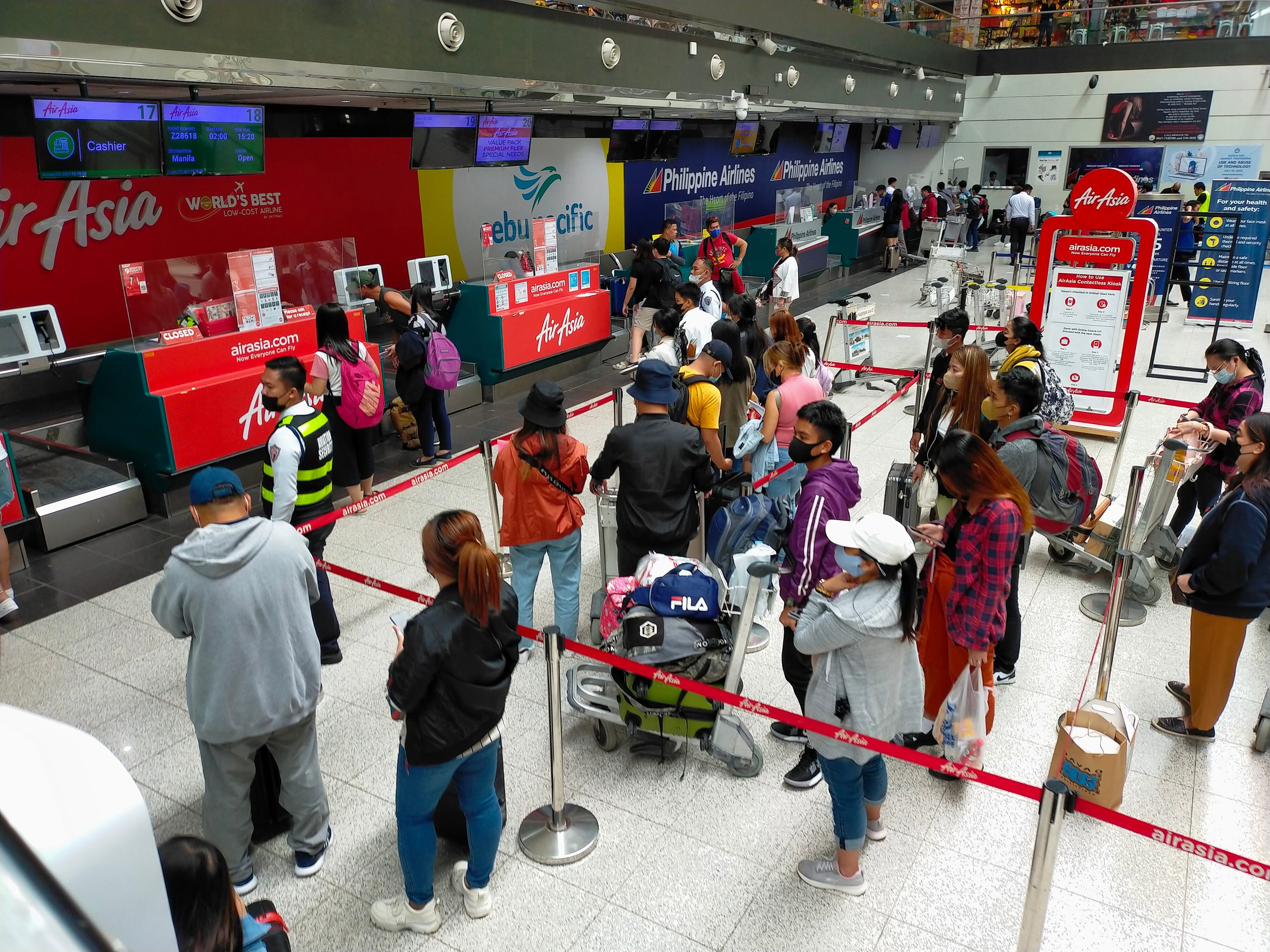 Passengers fall in line at the counter