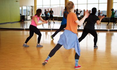 People dancing in front of the mirror