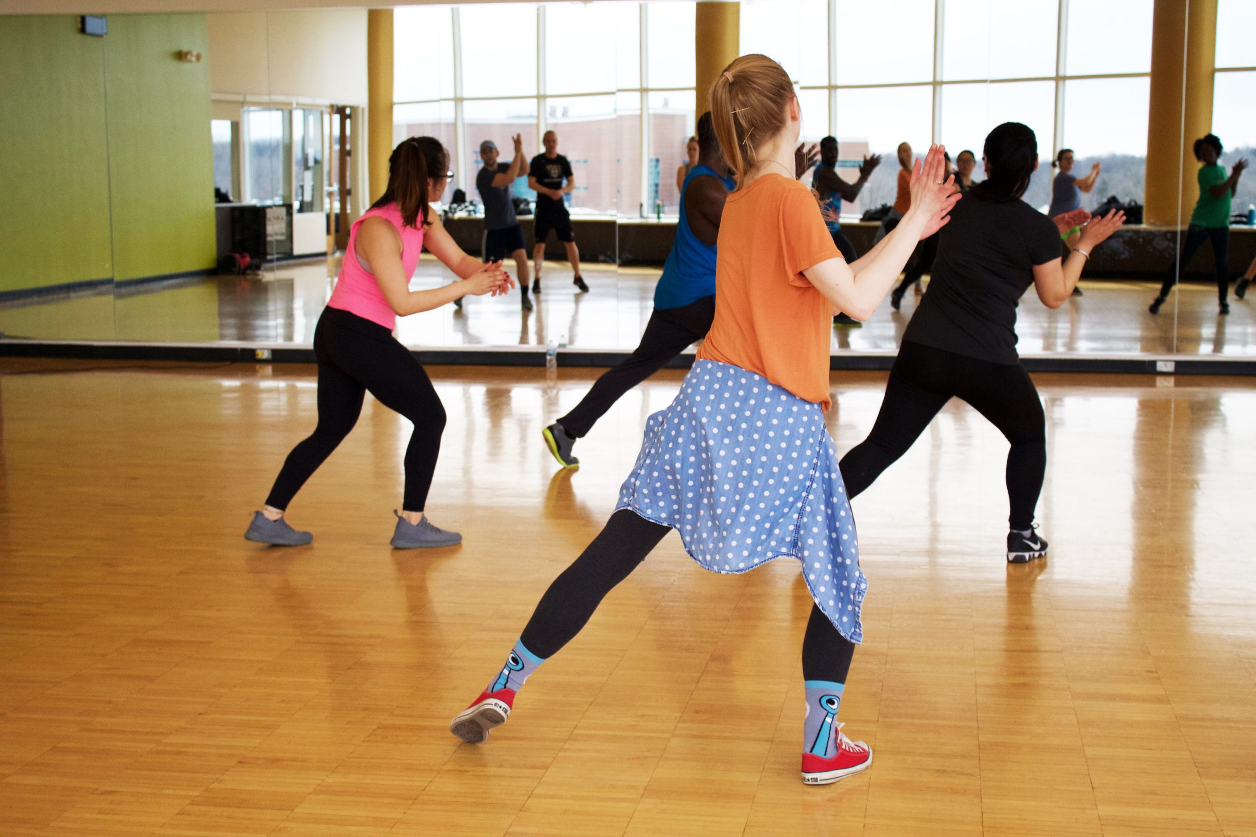 People dancing in front of the mirror