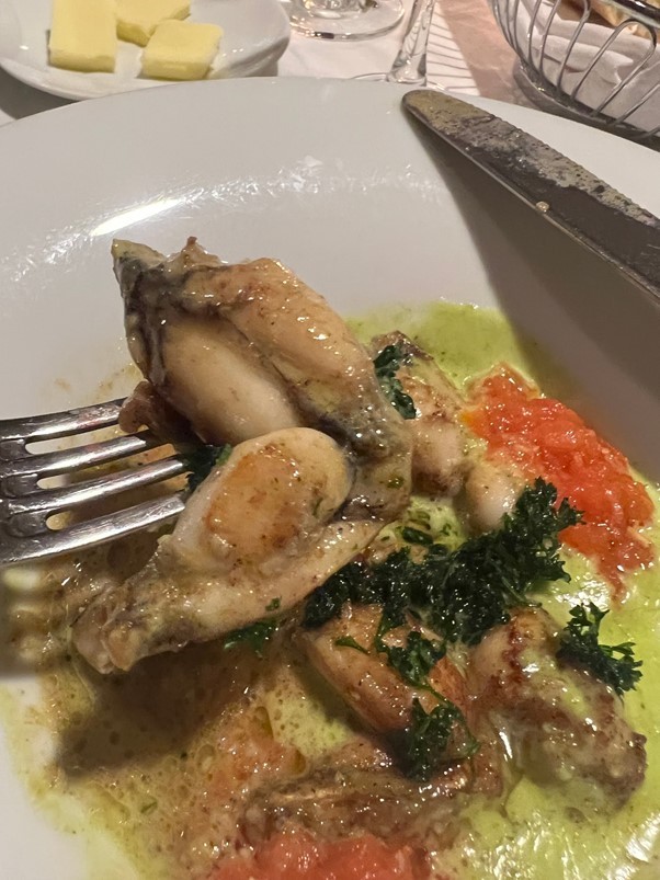 Frog legs with chive butter and tomato fondant.