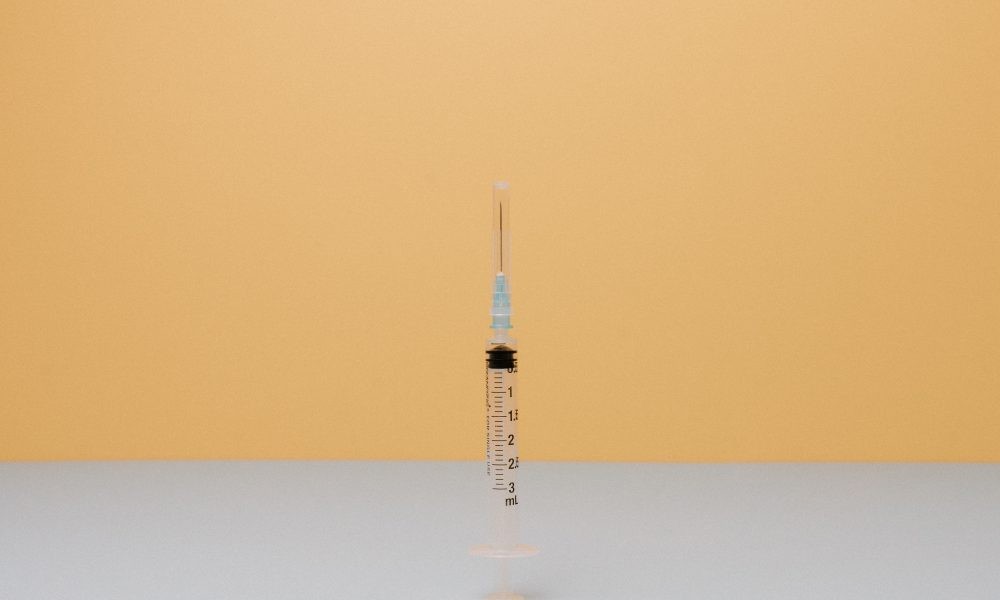 Syringe on White Surface