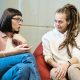 Women Talking While Sitting