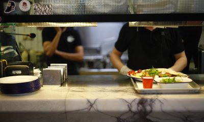 person serving food on tray