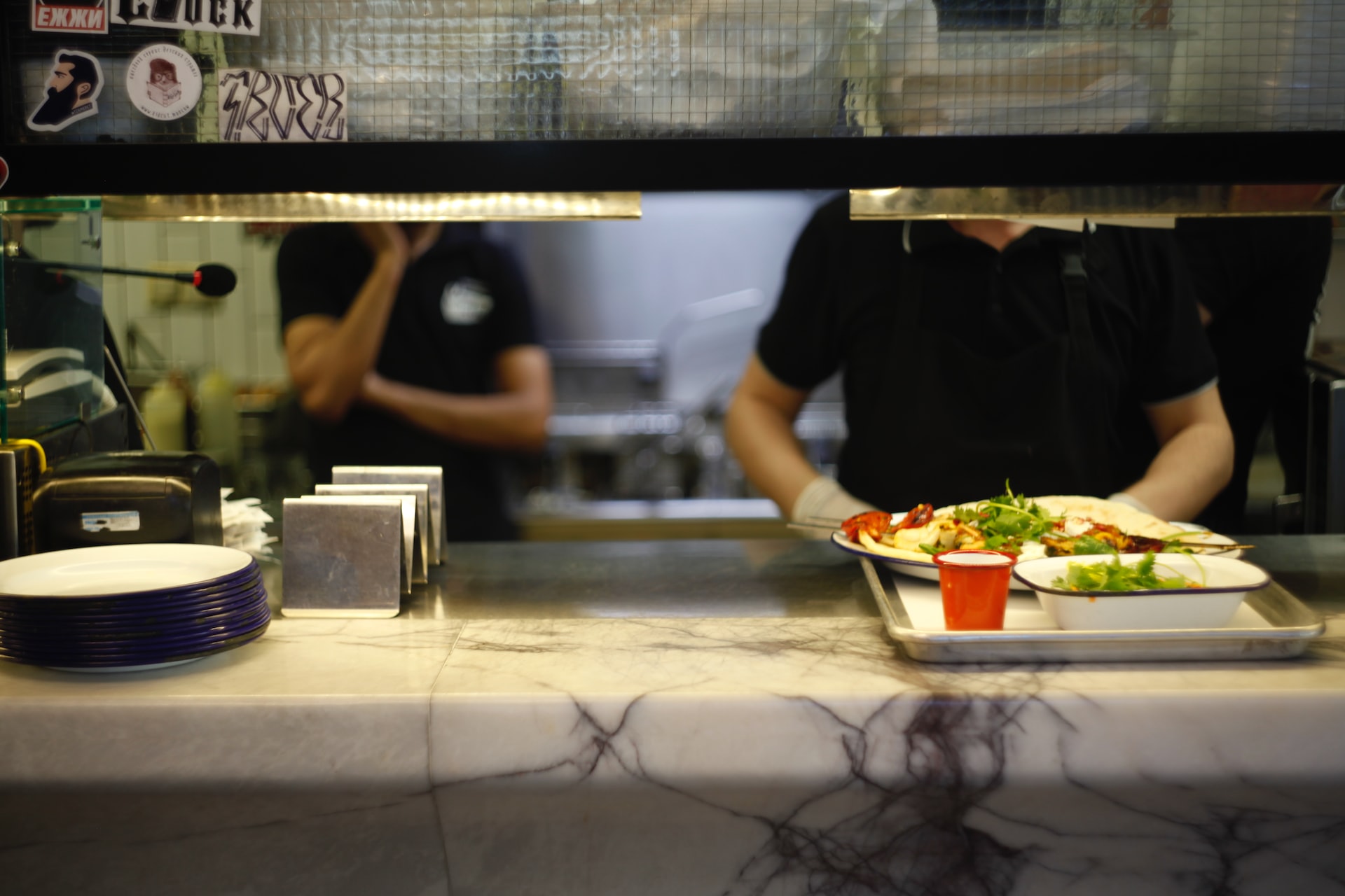 person serving food on tray