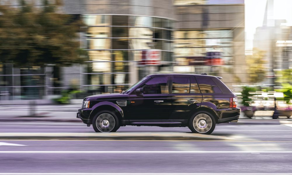 black SUV on the road
