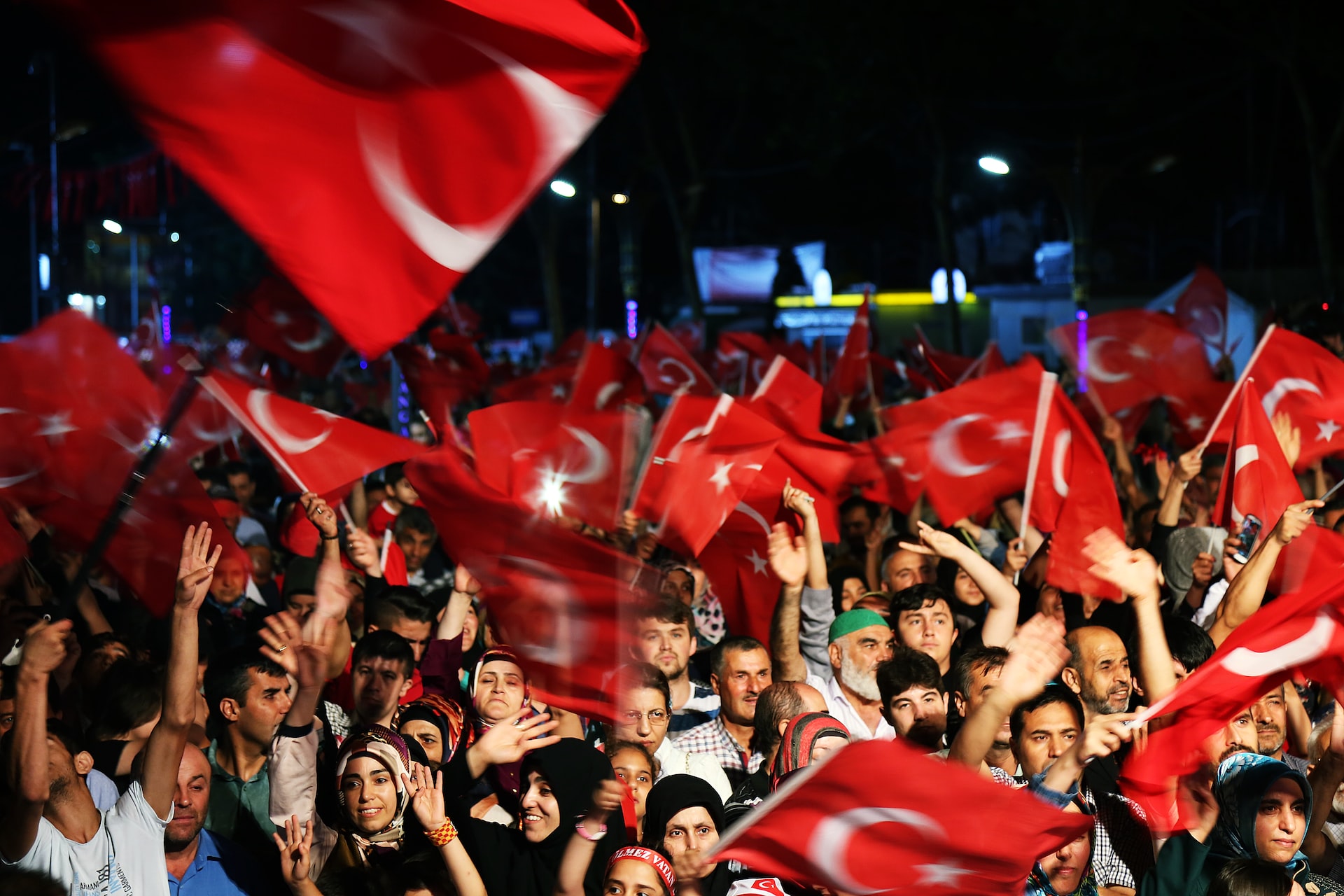 people waving Turkish flag