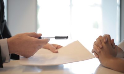 hand with paper and pen