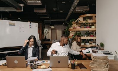 women and man working on desk