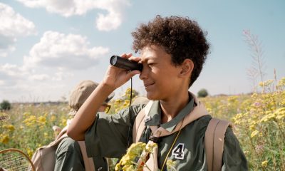 A Boy Using a Spotting Scope