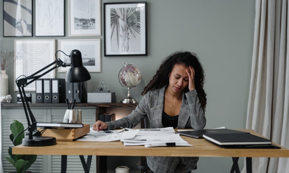 A Woman Working hard in the Office