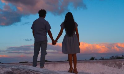 Back View of a Couple Doing Holding Hands