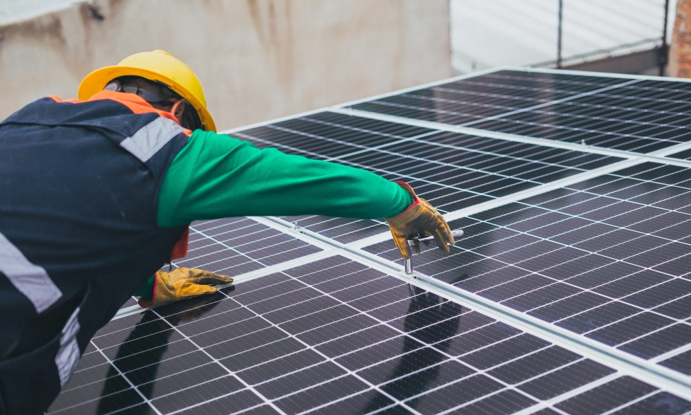 Solar Technician Installing Solar Panel
