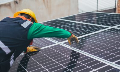 Solar Technician Installing Solar Panel