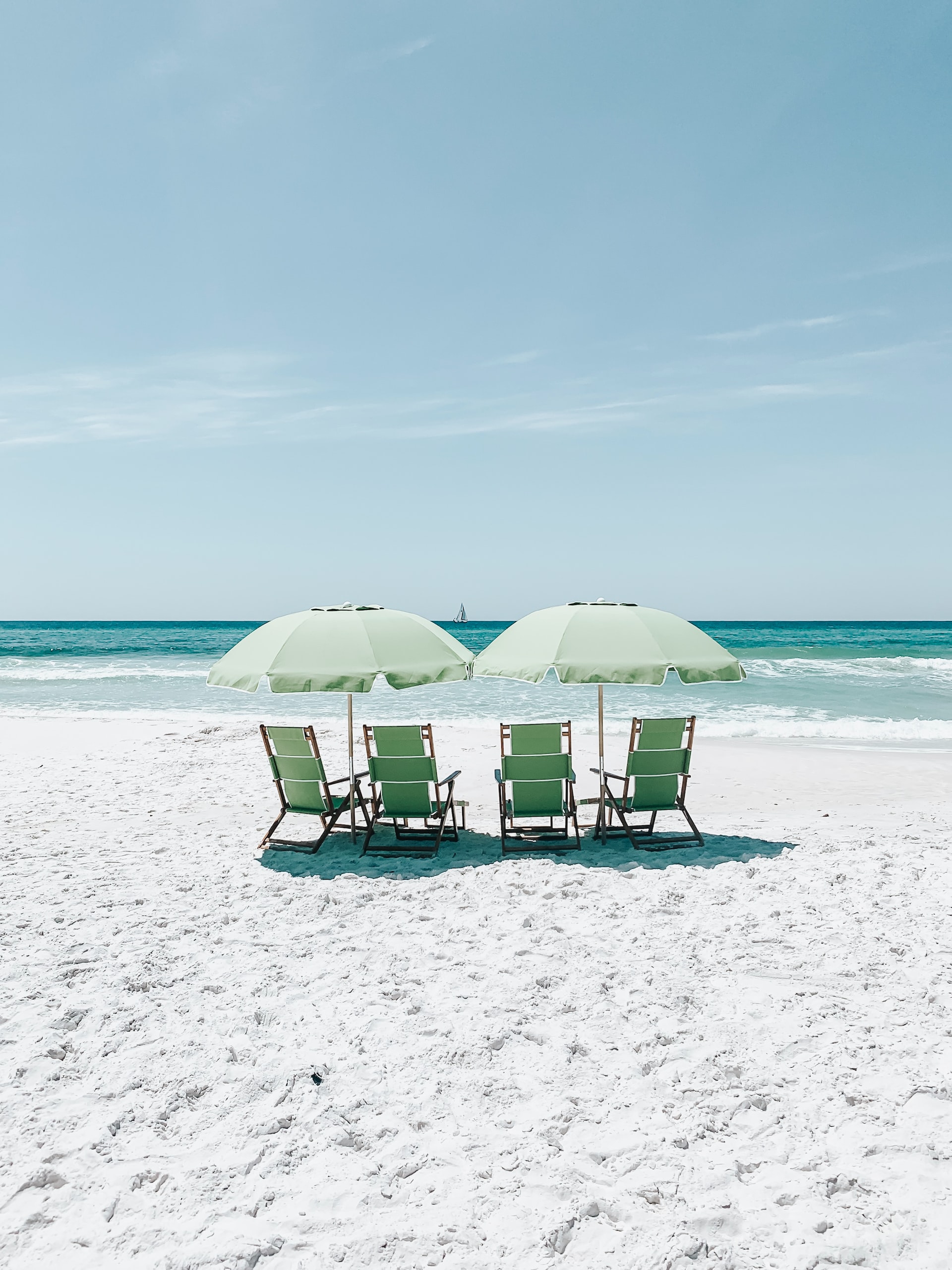 beach chairs under umbrellas