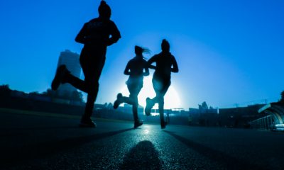 silhouette of three women running