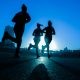 silhouette of three women running