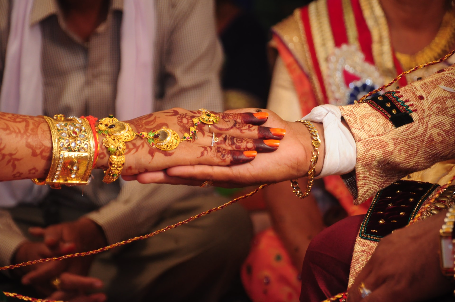 hands of India wedding couple