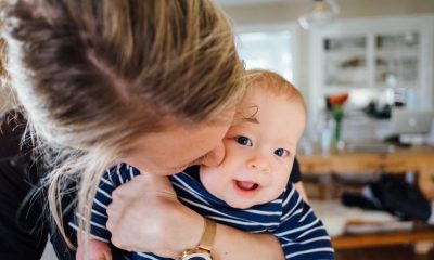 woman kissing baby's cheek