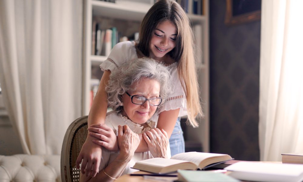 Photo of Woman Embracing Her Grandmother