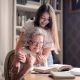 Photo of Woman Embracing Her Grandmother