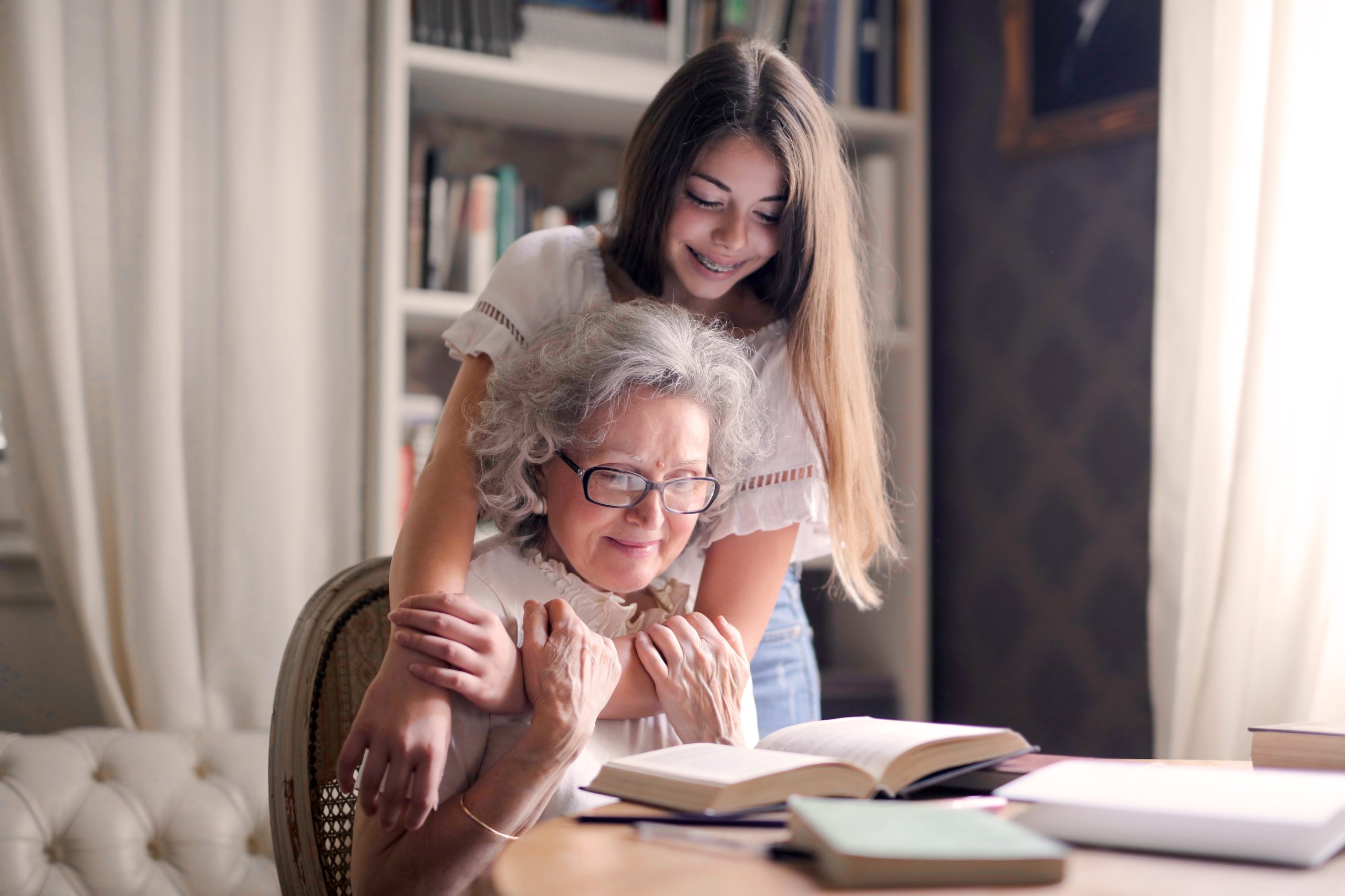 Photo of Woman Embracing Her Grandmother