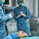 An Unconscious Female Patient Lying on an Operating Table