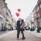 couple kissing in the middle of a street