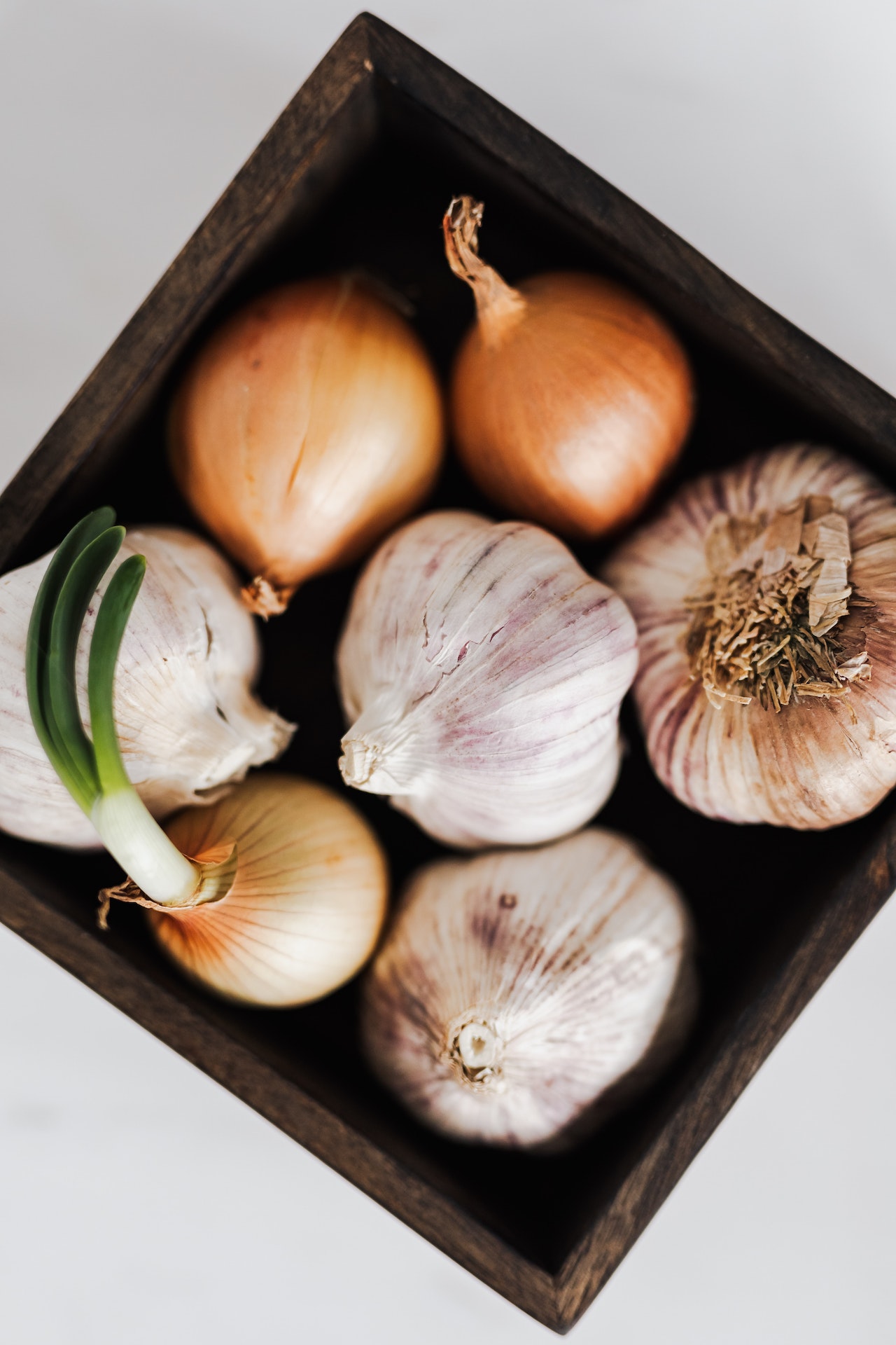 onion and garlic on tray