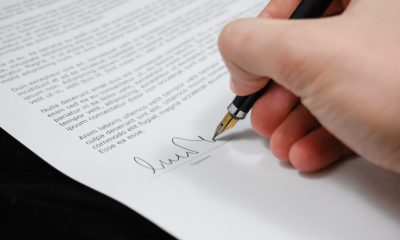 Person Signing in Documentation Paper