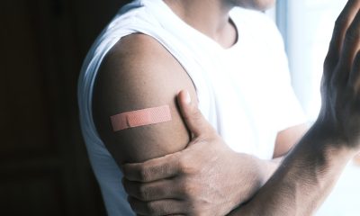 man's arm with bandaid