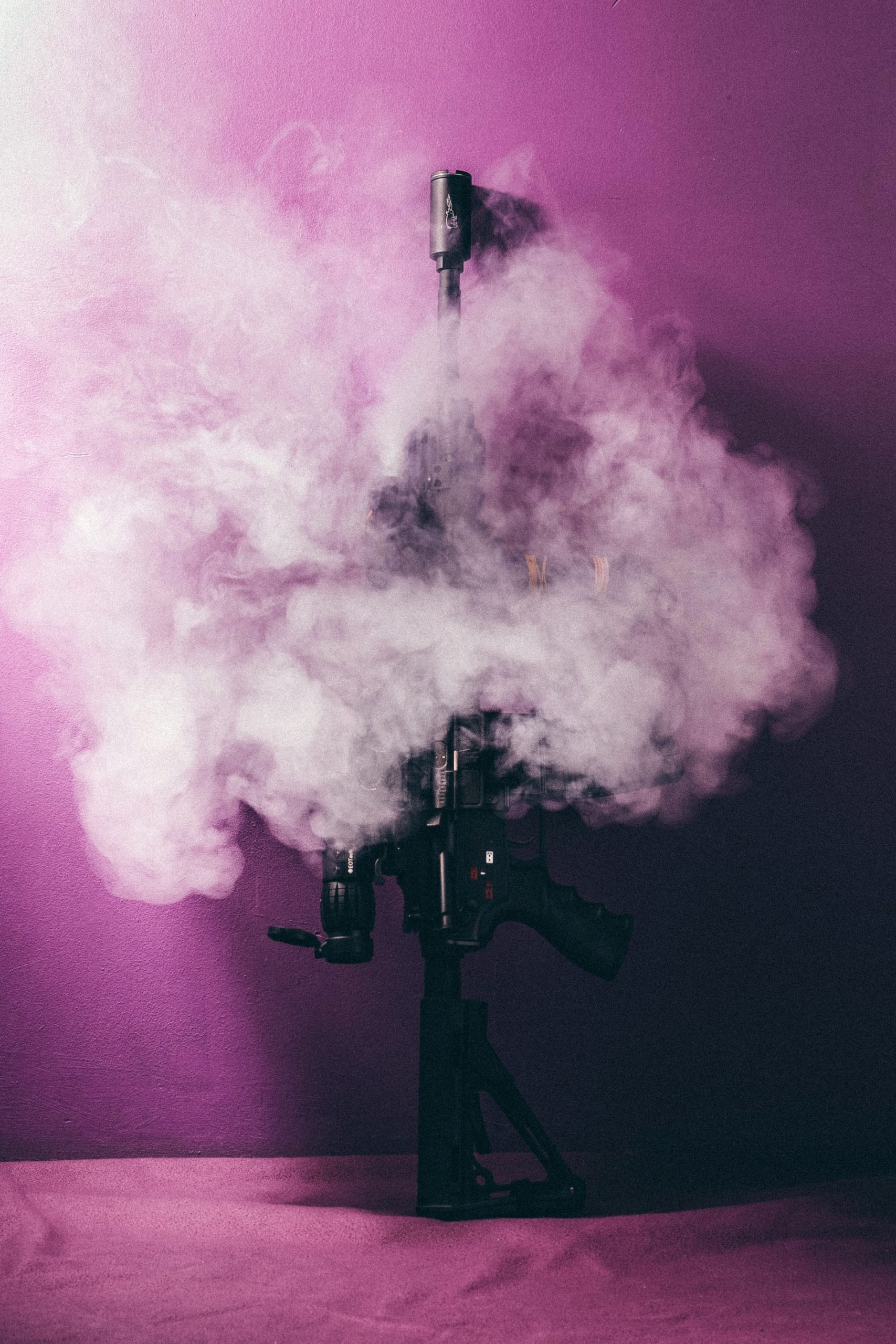 pink light with smoke gun