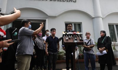 lawyer in front of media