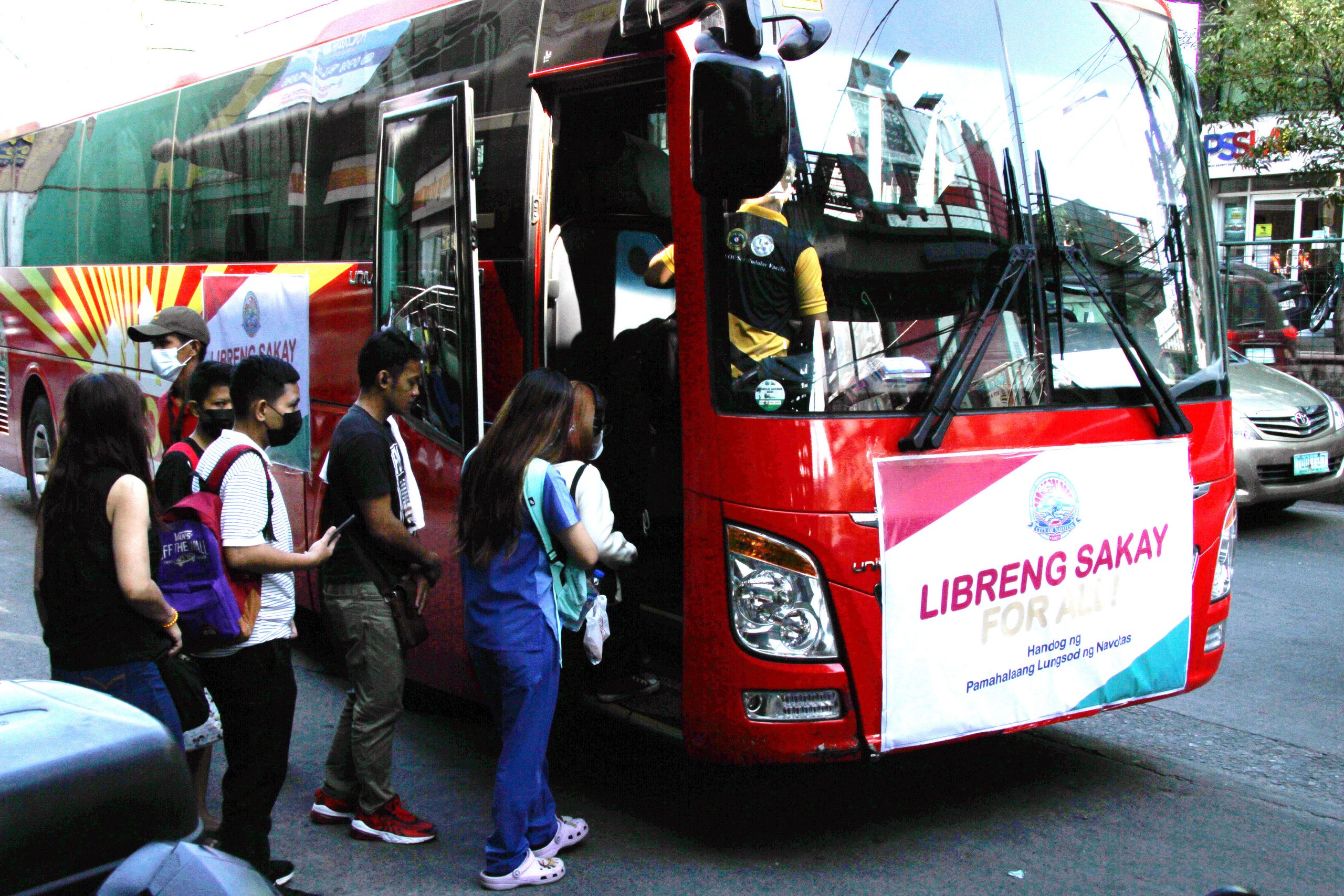 commuters entering a bus