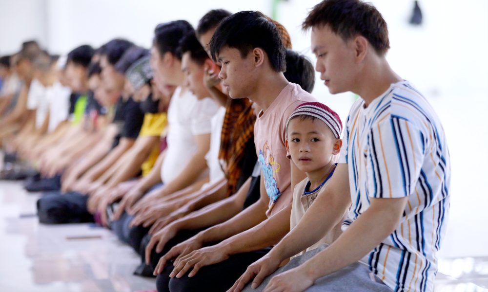 Muslim kneeling for prayer
