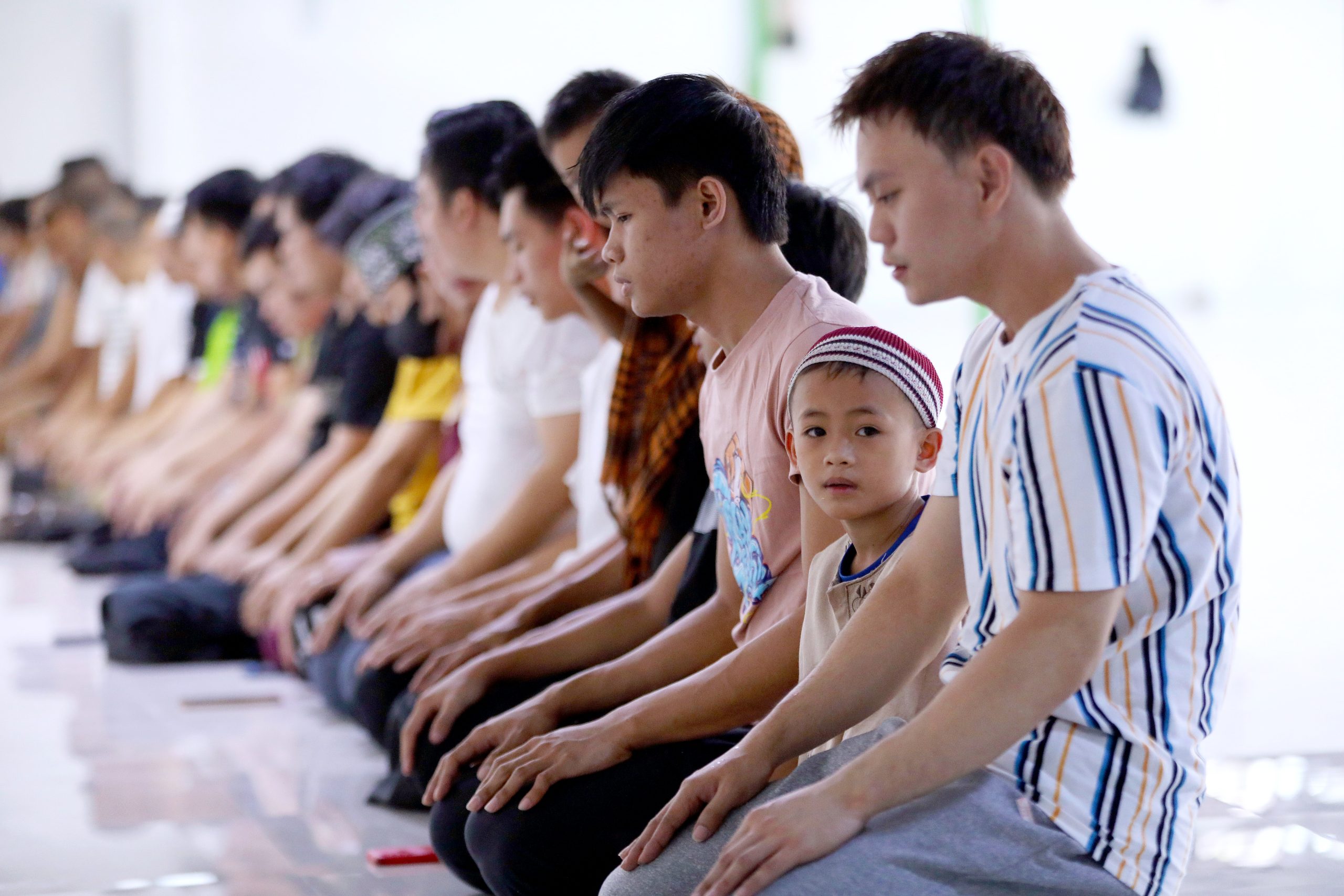 Muslim kneeling for prayer