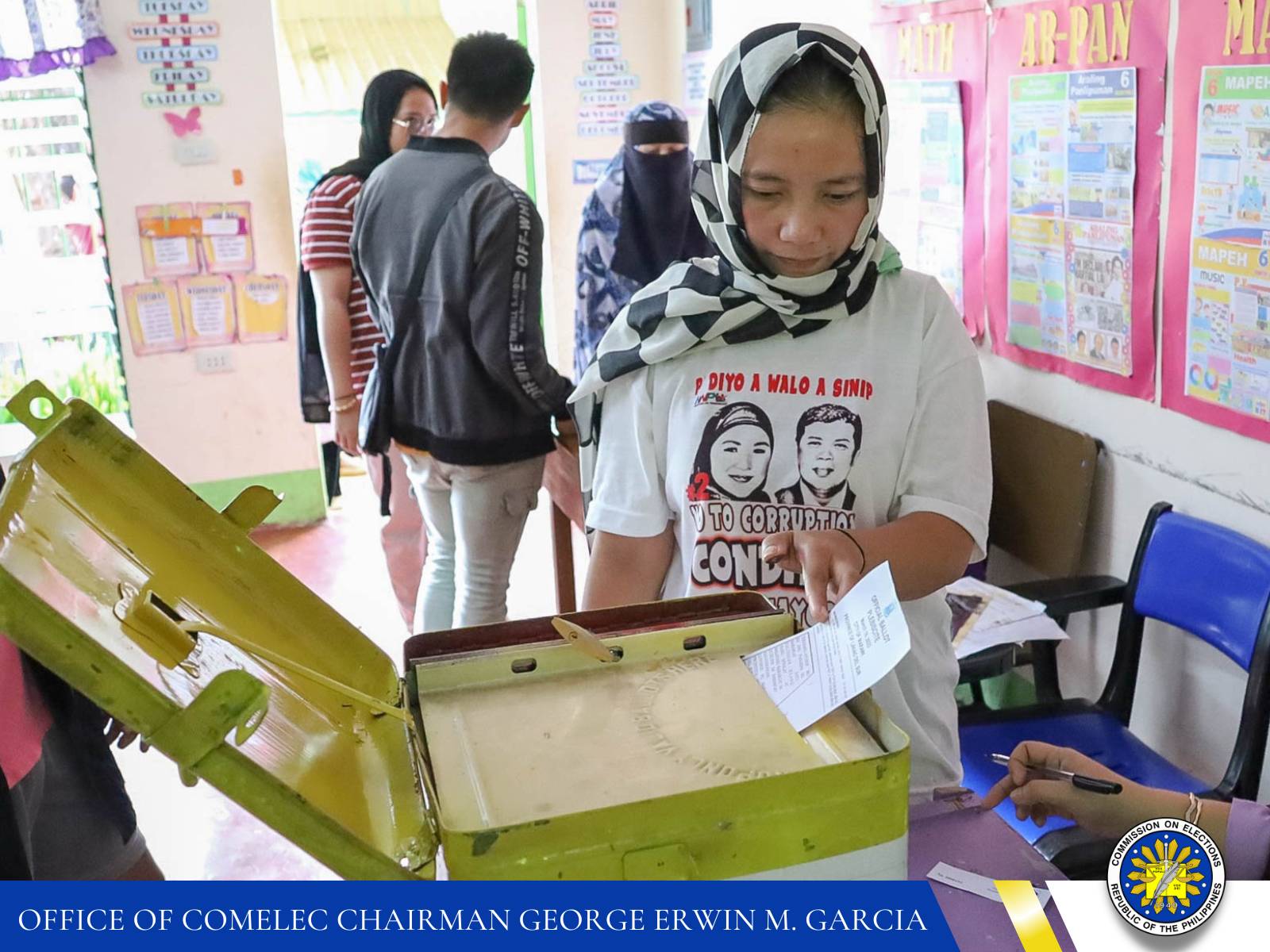 person drawing her ballot