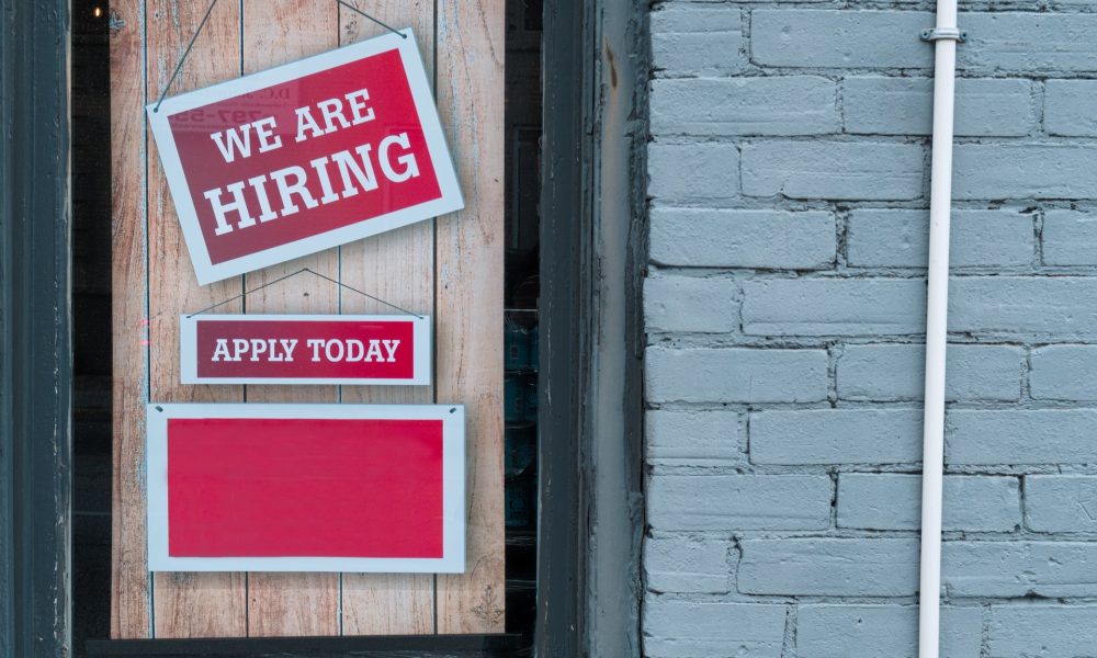 "We are hiring" post on door