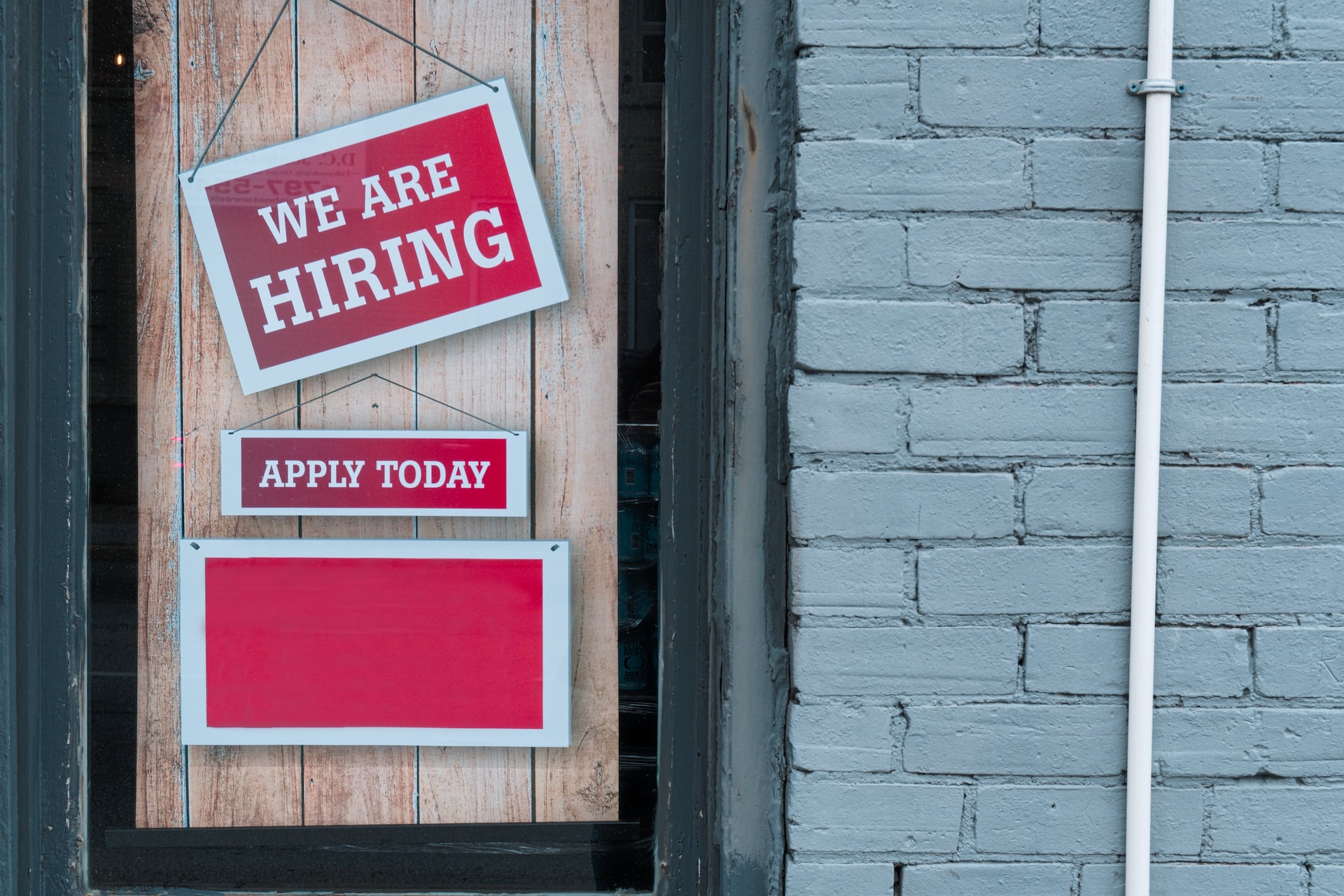 "We are hiring" post on door