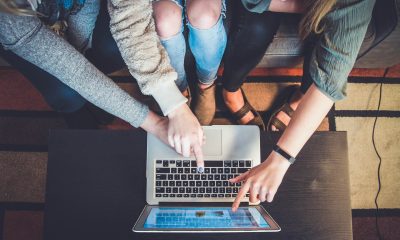 girls pointing at laptop screen