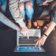 girls pointing at laptop screen
