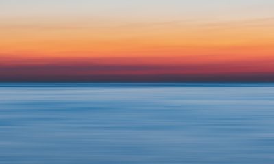 Calm Body Of Water During Golden Hour