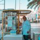 Man Standing Near a Food Cart