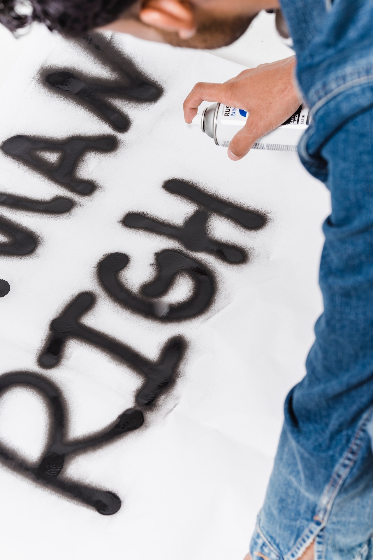 man painting "human rights"