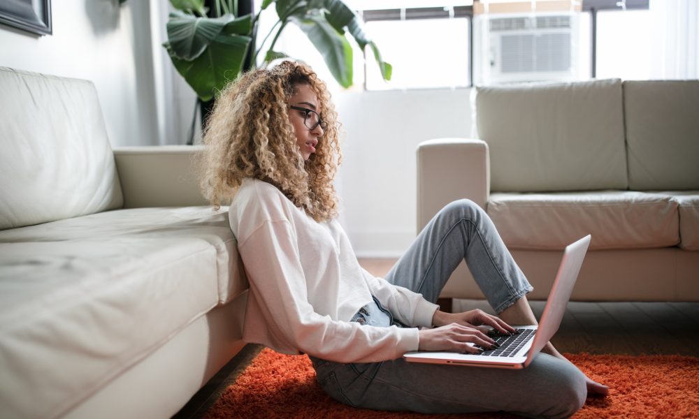 woman sitting working on laptop