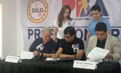 officials signing documents
