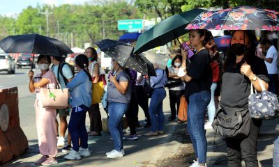 commuters in heat outside