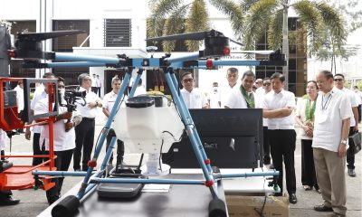 PBBM checking on a machinery with other officials