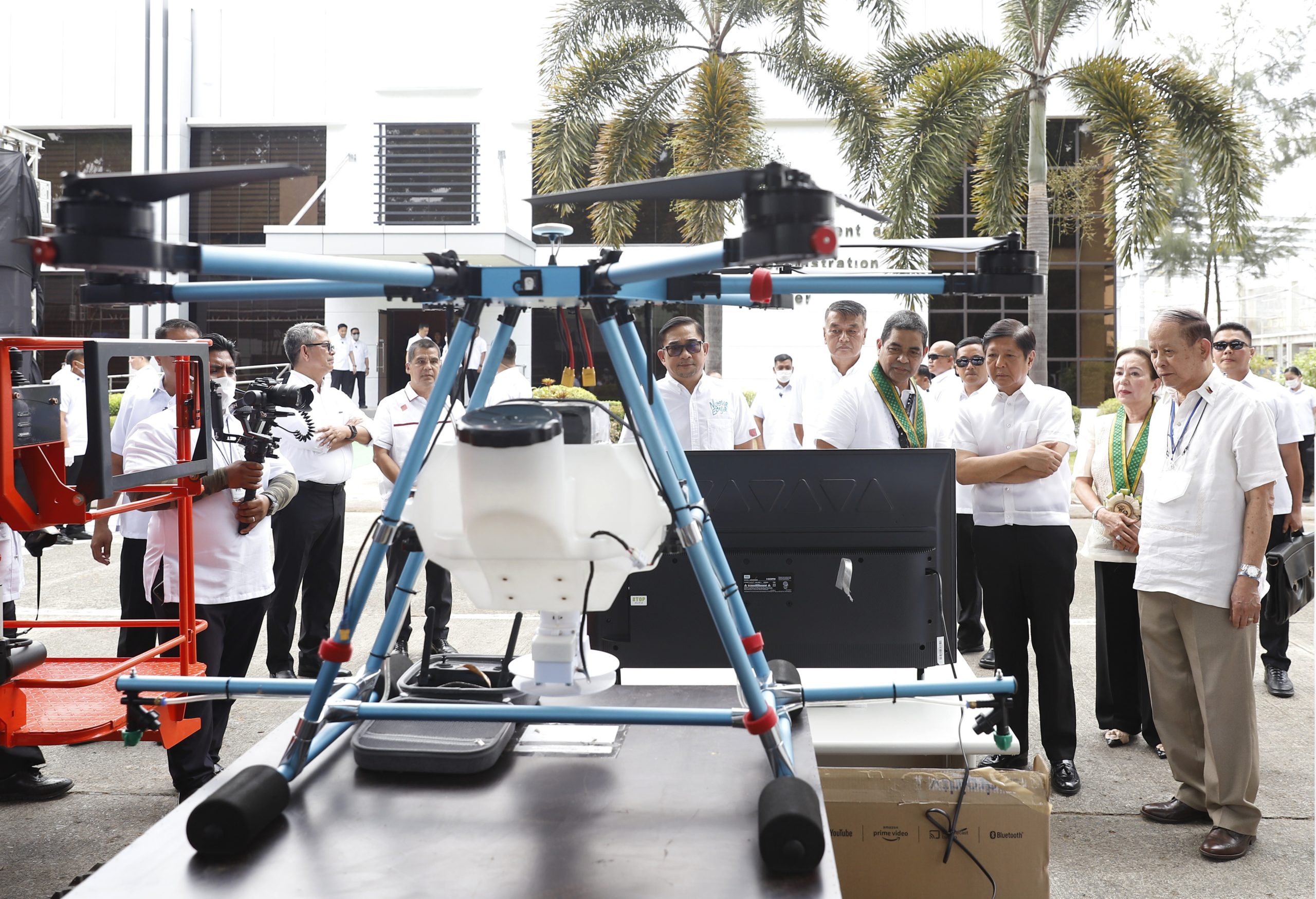 PBBM checking on a machinery with other officials