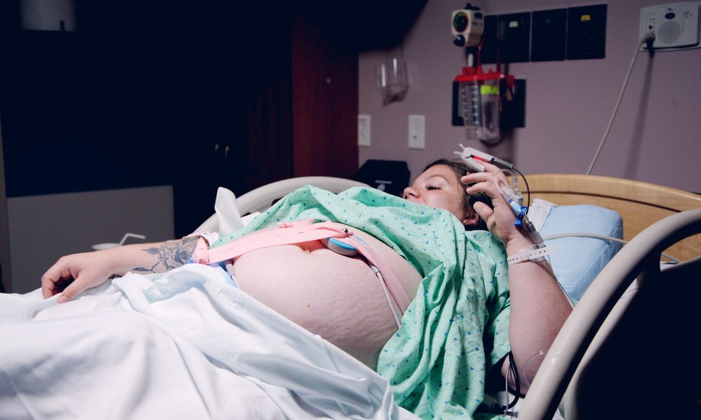 woman in labor on hospital bed